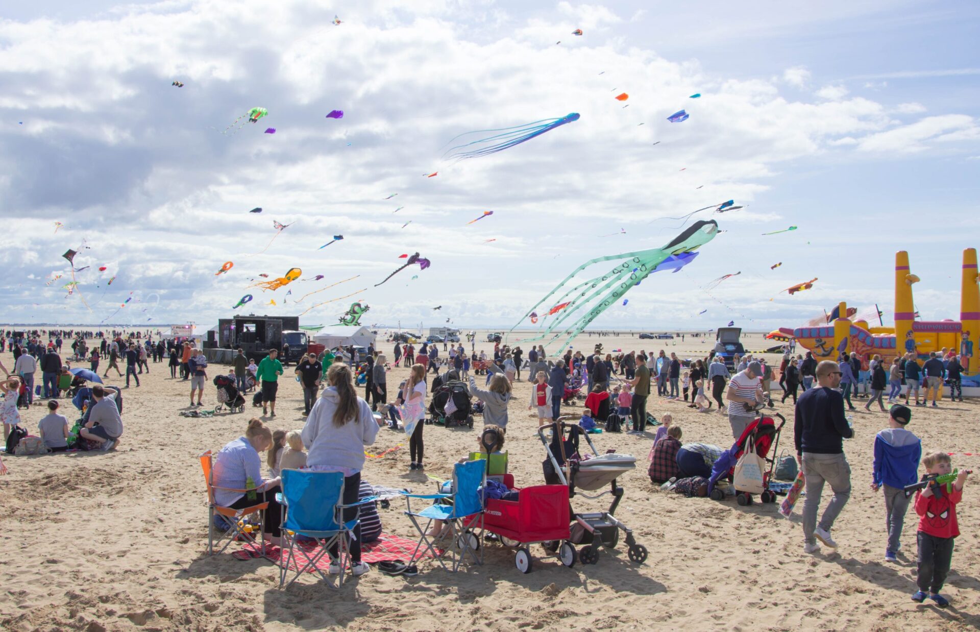 Event on a beach with kites flying