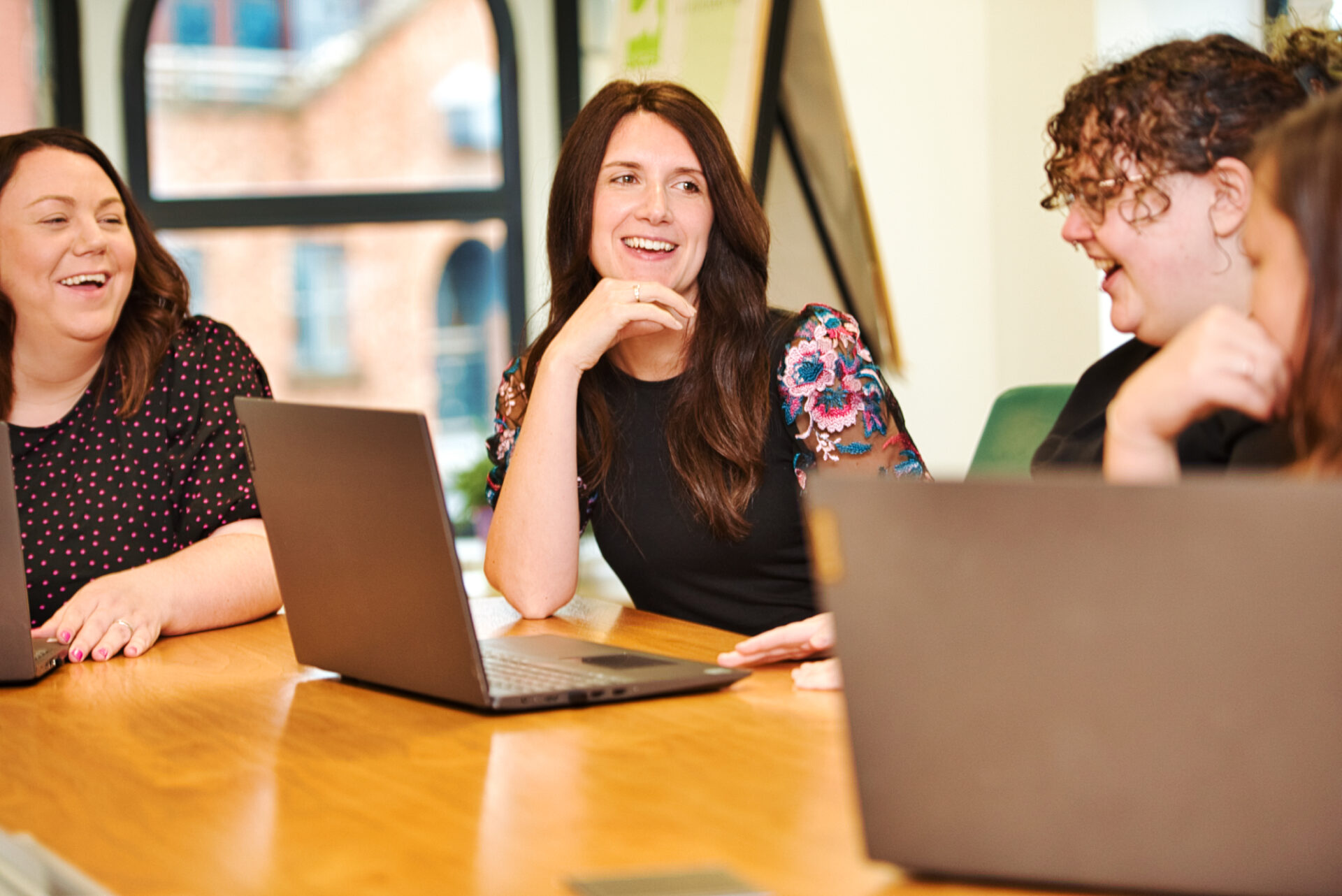 Three staff from CFLM talking in the office